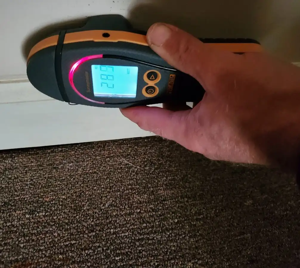 Moisture detection at baseboard during Storm Damage Restoration in Somersworth